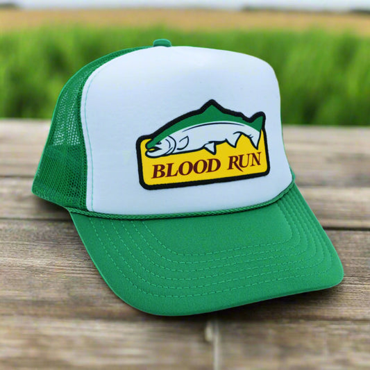 Green and white cap with 'Blood Run' logo on a white background
